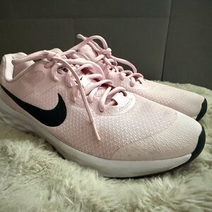 Nike Women's Light Pink Running Shoes with Black Swoosh